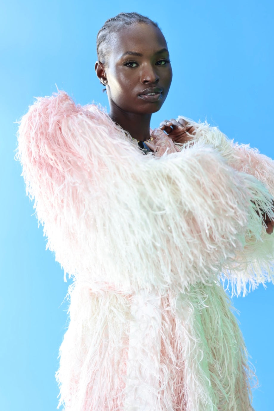 The Shaggy Brigitte Coat has an ombre effect from light pink to creamy white. The subtle sparkles will make you feel like a princess.