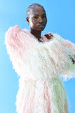 The Shaggy Brigitte Coat has an ombre effect from light pink to creamy white. The subtle sparkles will make you feel like a princess.