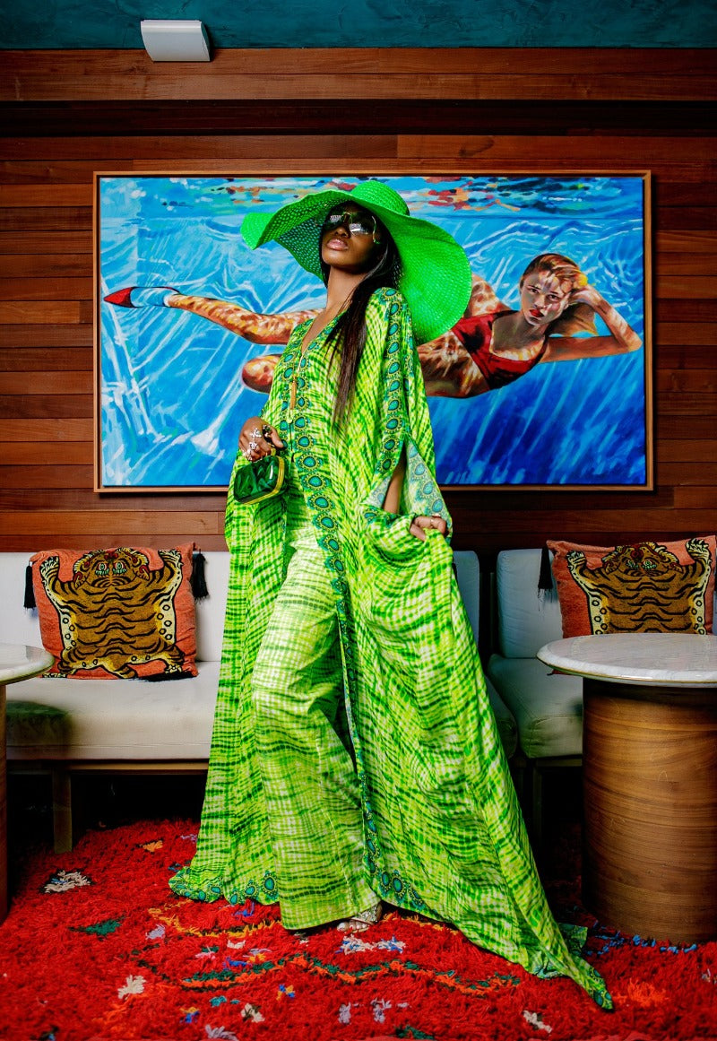 shopping for resort and vacation-ready pieces, big green hat
