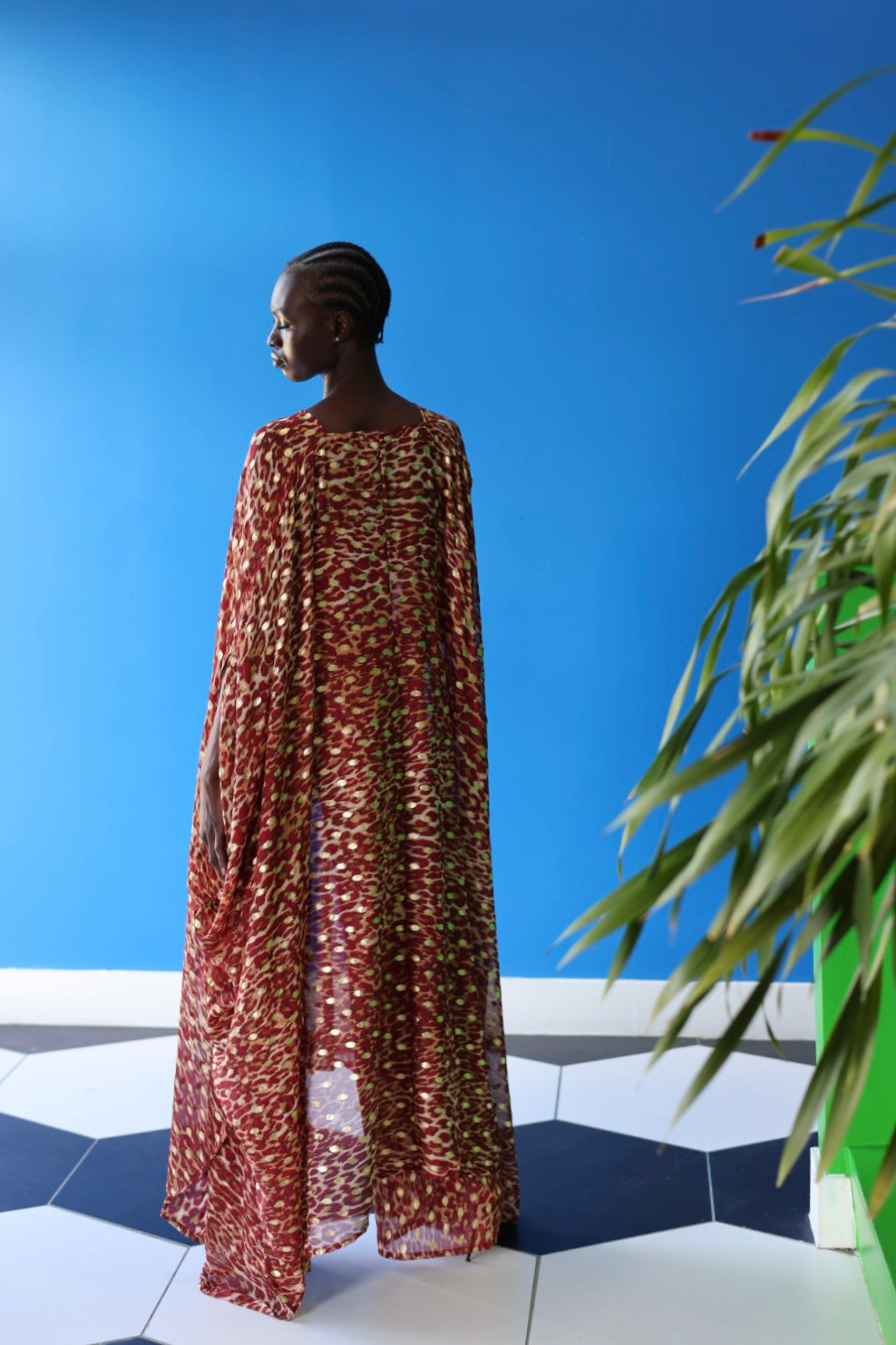 The Afet Pants feature a ruby red and beige cheetah print pattern. Pair these pants with the matching Acacia Goddess Kaftan.