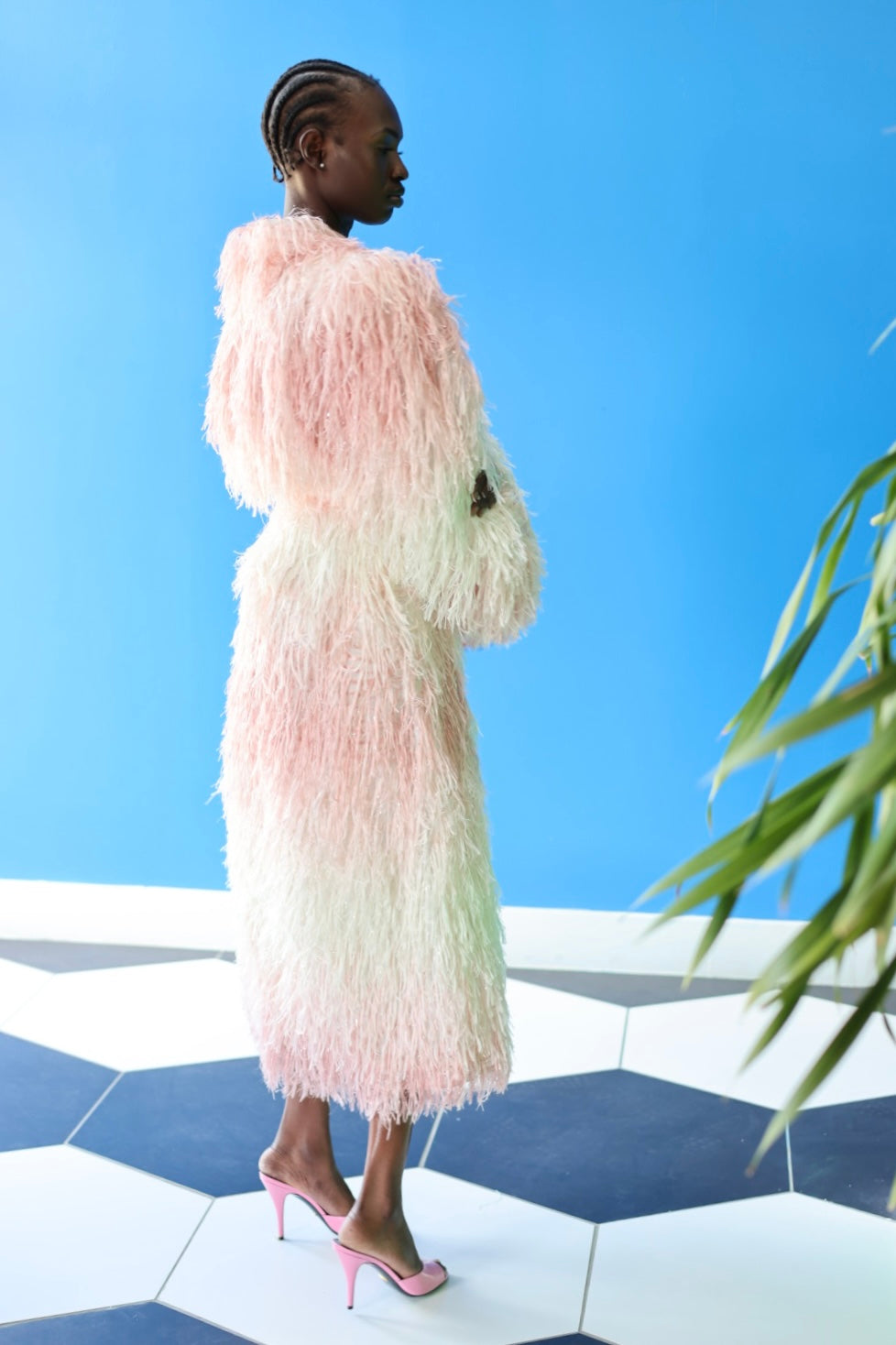 The Shaggy Brigitte Coat has an ombre effect from light pink to creamy white. Make a stunning silhouette.