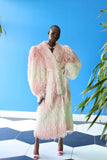 The Shaggy Brigitte Coat has an ombre effect from light pink to creamy white.
