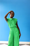 The celeste jumpsuit drapes elegantly down the body in a green-toned zebra print. The emerald green drapery mixes fun and fab into the perfect combination.