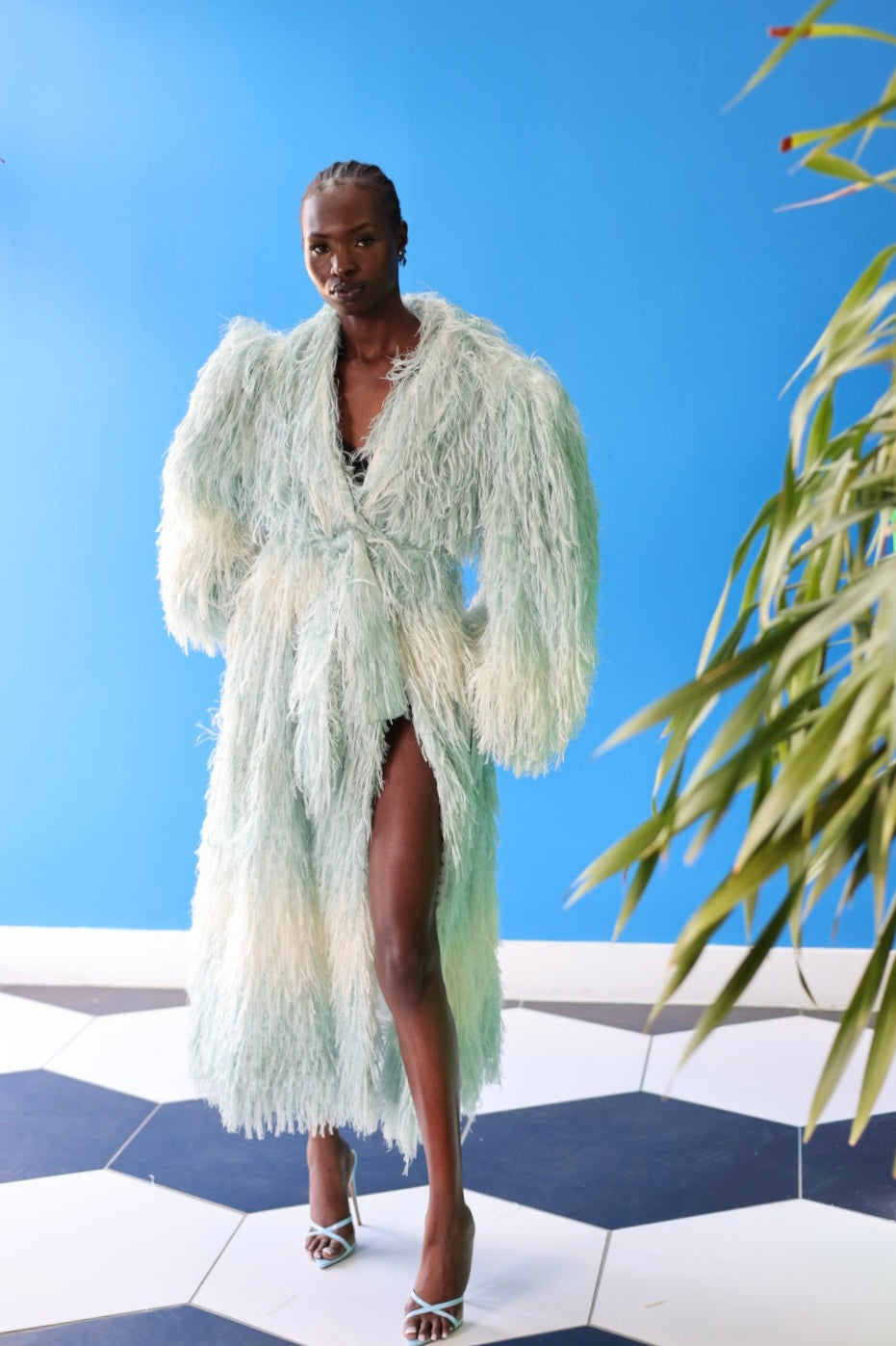 The Enola Shaggy Coat has an ombre effect from light blue to creamy white.