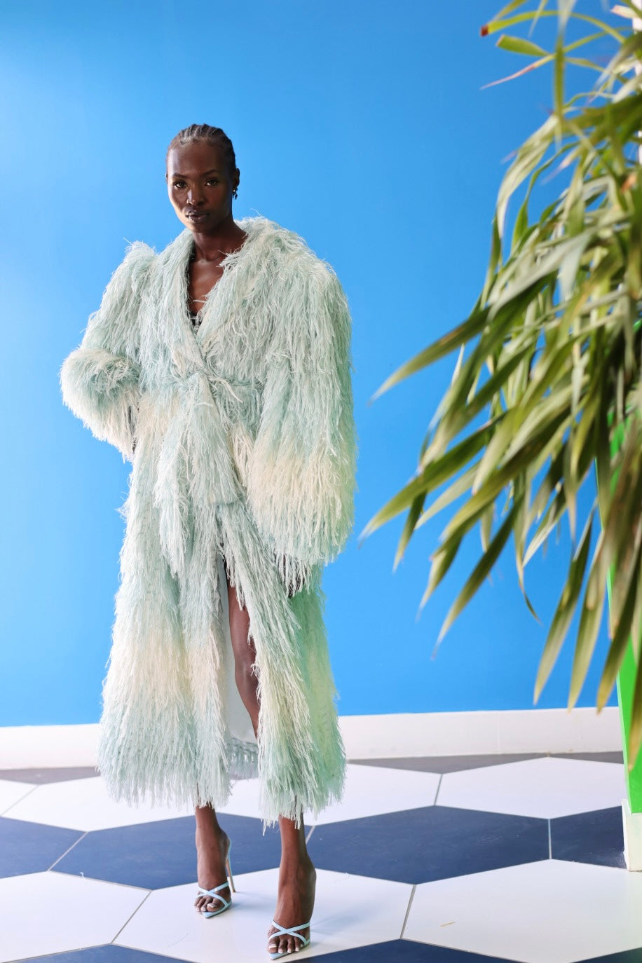 The Enola Shaggy Coat has an ombre effect from light blue to creamy white. The lantern sleeves add an element of grandeur and make this coat suitable for a wide range of body types.