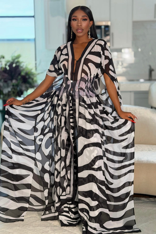 Karmyn Pants by Sai Sankoh in black and white print, worn under the matching kaftan held open, front view