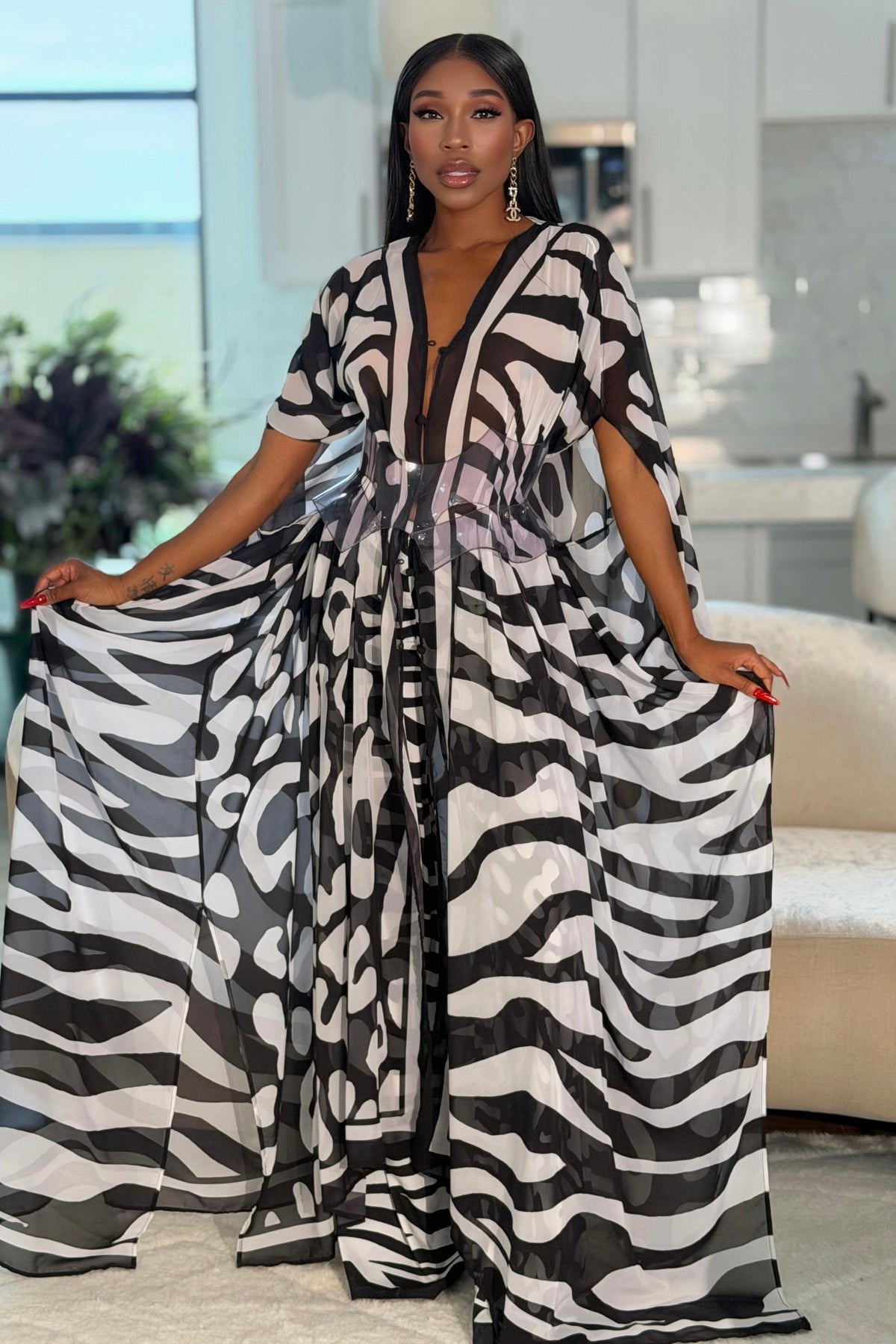 Karmyn Pants by Sai Sankoh in black and white print, worn under the matching kaftan held open, front view