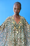 The Joanna Kaftan is a forest green and beige cheetah print kaftan with specks of gold through the design. She looks amazing with a wide range of jewelry.