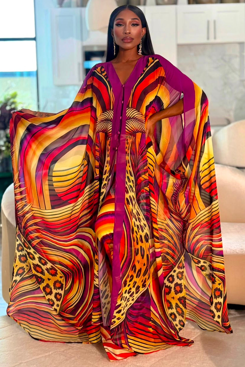 Woman wearing the Sahara Sunrise red, orange and purple Goddess Kaftan