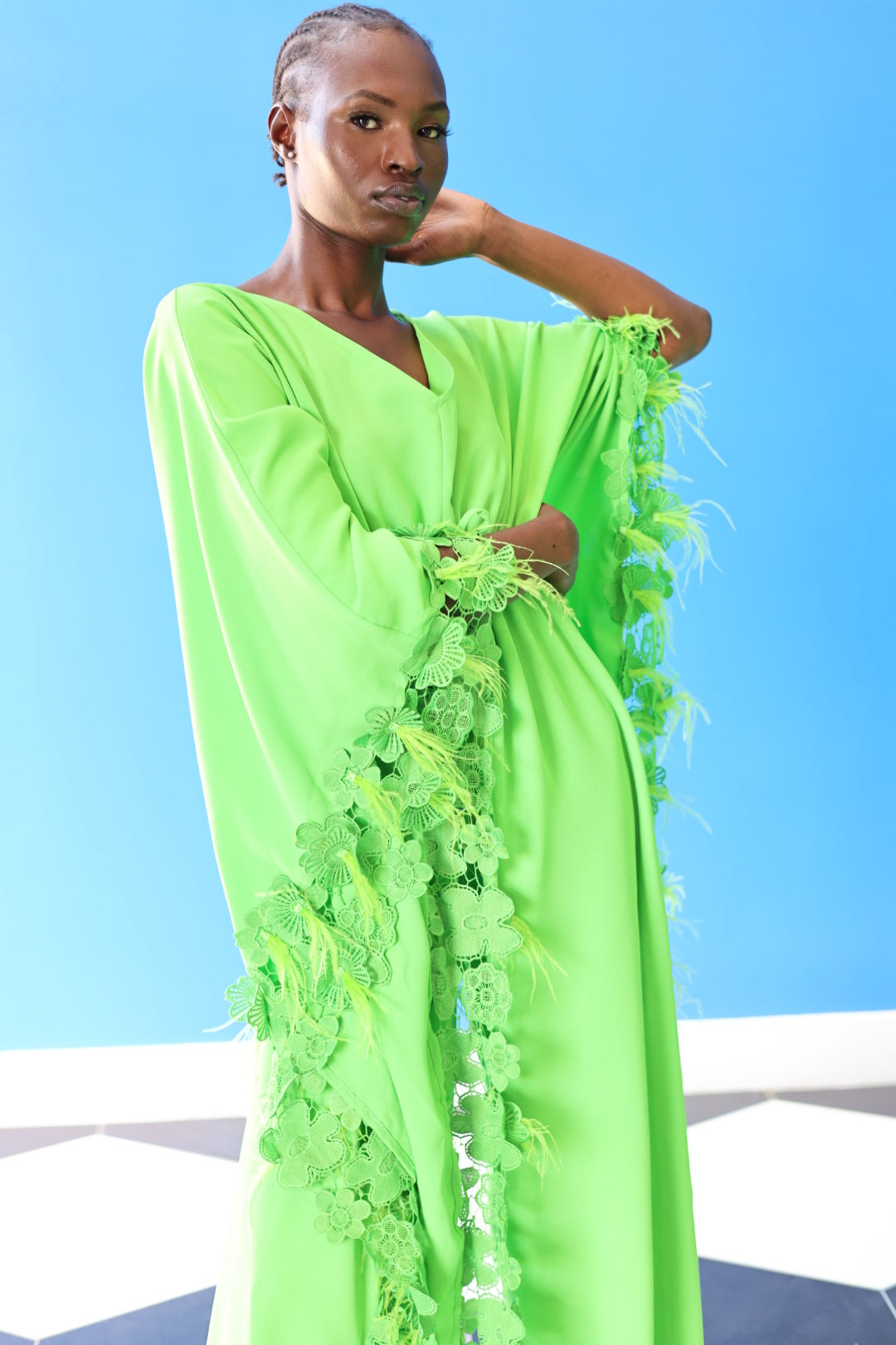 The Poppy Floral Jumpsuit in Green has gorgeous floral lace at the edge of the fabric, along with faux feathers that create a fun texture. The wide sleeves and wide legged pants allow you to feel free and fabulous at the same time.