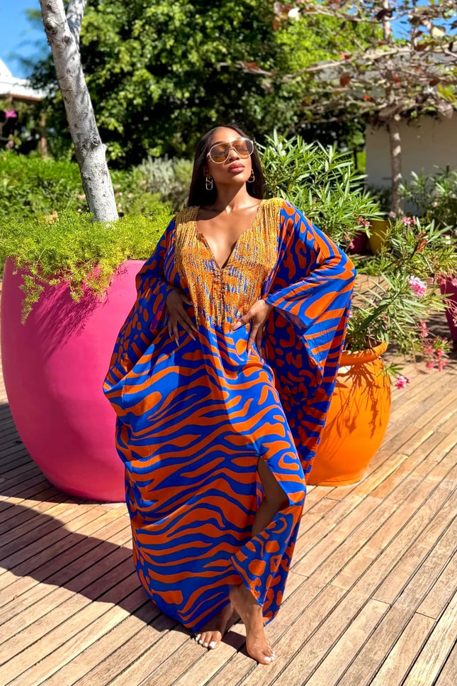 Lisa Box Kaftan by Sai Sankoh, blue and orange print kaftan styled outdoors