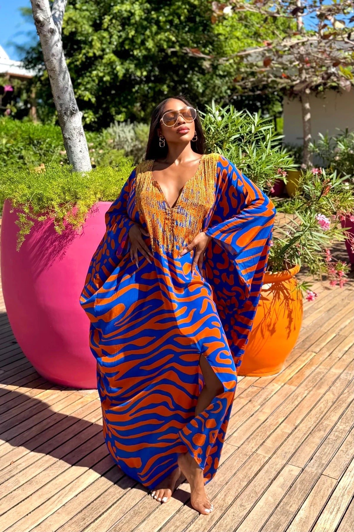 Lisa Box Kaftan by Sai Sankoh, blue and orange print kaftan styled outdoors