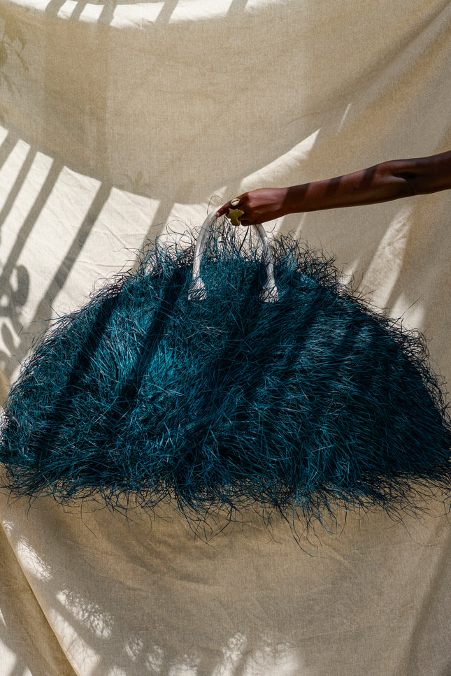 Esther by Sai Sankoh, luxury resort bag